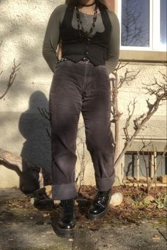 A mid-size person/girl wearing a blck tight waistcoat with a tight sage green long sleeve underneath, vintage black jeans, platform dr. Marten shoes and multiple crystal rings and bracelets. The person is also wearing multiple silver necklaces, one in form of a fairy, another in form of a moon, one in form of a butterfly, a thrifted black bead necklace and a green crystal bead necklace. Fairy Core Pants Outfit, Mid Sized Dresses, Aesthetic Clothes Mid Size, Mid Sized Aesthetic, Mid Size Clothing, Earthy Layered Outfits, Dark Fairy Inspired Outfit, Earth Goth Aesthetic, Fairy Core Outfits Pants