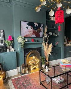 a living room filled with furniture and a fire place in front of a painting on the wall