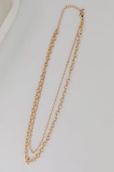 Adding the Sadie Gold Layered Chain Necklace to your daily necklace stack is guaranteed to up the cool-factor of any look! This trendy necklace features two layers of gold chains. Style the Sadie Necklace with any outfit to instantly upgrade your look! Gold Plated Layered Lobster Clasp with Extender Layer 1 | Length 8" Layer 2 | Length 7.5" Extender | Length 3" Trendy Multi-strand Layered Chain Necklace, Trendy Chain Link Layered Necklace, Trendy Layered Metal Chain Necklace, Trendy Layered Chain Link Necklace, Gold Layered Chain Link Necklace, Trendy Layered Necklace With Double Chain Link, Trendy Multi-strand Layered Necklace With Double Chain, Gold Link Chain Layered Necklace, Trendy Gold Double Chain Necklace