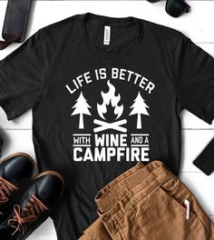 This "Life Is Better With Wine And A Campfire" design is the perfect shirt for anyone that wants to just go to the mountains or anywhere outdoors and drink some wine! All shirts are unisex (Male & Female) and any tee with rolled sleeves is done just for the picture. Black Hiking T-shirt With Letter Print, Black T-shirt For Hiking With Letter Print, Black Letter Print T-shirt For Hiking, Outdoor Black T-shirt With Screen Print, Black Graphic Tee For Camping, Black Crew Neck T-shirt For Camping, Black Graphic Print T-shirt For Camping, Family Bonfire, Campfire Design