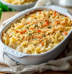 a white casserole dish filled with macaroni and cheese