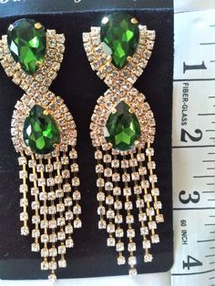 Women's Emerald Color and Crystals Dangle Chandelier Earrings.   Celebrity Gold Tone Accent, Suitable for Pierced Ears.  See Other Jewelry, Fashion Items, and Collectibles Inside This Store. Thank You For Shopping At Celestial Selections. Please Visit Again Soon. Diy Wire Earrings, Earrings Chandelier, Emerald Color, Earrings Green, Embroidery Craft, Blue Necklace, Wire Earrings, Girls Earrings, Fashion Items