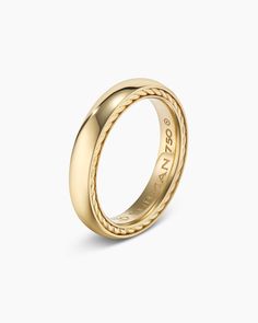 a yellow gold wedding ring with braiding on the outside and inside, set against a white background