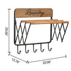 a wooden bench with two metal hooks and a sign that says laundry hanging on it