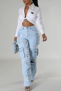 Take on new challenges with our High Rise Multi Pockets Distressed Cargo Jeans! Complete with a high rise waist and multiple pockets, these jeans are perfect for the risk-taker in you. Featuring a distressed design, they add a touch of adventure to any outfit. Ready to conquer the day ahead? These jeans have got you covered. High Rise -Light Blue Washed -Distressed -Multi Pockets -Cargo Jeans -Stretch Denim Fabric Contents 98% COTTON, 2%SPANDEX High Rise Light Wash Cargo Jeans For Fall, Spring Ripped Cargo Jeans In Denim Blue, Trendy Ripped Cargo Jeans For Spring, Ripped Denim Blue Cargo Jeans For Spring, Spring Ripped Denim Blue Cargo Jeans, Ripped Medium Wash Cargo Jeans For Spring, High Waist Ripped Cargo Jeans For Spring, Spring Ripped Blue Cargo Jeans, Ripped Blue Straight Leg Cargo Jeans