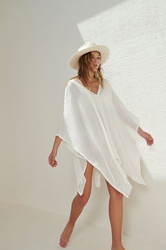 Make a memorable statement by the sea or in the lounge with the hand loomed Ava Kimono White Stripes. An asymmetric frayed hem along with side slits, add movement and flow to a roomy drape. Featured artisanal striped motifs woven into its flowy fabric which boasts a linen-like feel. Breathable fibers and naturally built-in cooling properties make this the perfect beach kaftan. - V-neckline- Frayed & asymmetric hem- Side slits- Ultra-soft 100% Turkish cotton- One size fits most Beach Kaftan, The Lounge, Mens Fashion Trends, By The Sea, Kimonos, Fast Fashion, The Sea, Chic Style, White Stripe