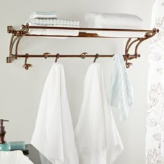 two towels hanging on a towel rack in a bathroom