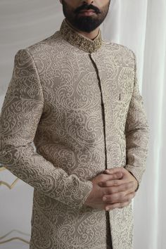 This light brown sherwani features intricate thread jal and a silk inner kurta pajama, paired with a tissue silk Rajasthani kula (turban) and a ruby stone brooch. Elevate your style with this royal look, perfect for special occasions. 4-Piece Suit Royal Look, Kurta Pajama, Ruby Stone, Wedding Men, Winter Women, Light Brown, Ruby, Thread, Silk