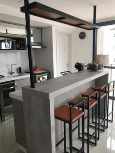 an image of a kitchen setting with bar stools