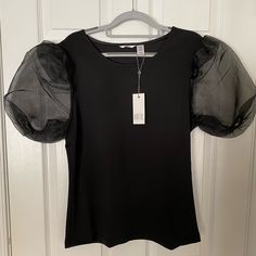 Pretty Blouse Great For Holiday Parties, With Sheer Sleeves, Nwt. Approx 21” Pit To Pit, 26” Long. Party Tops With Mesh Short Sleeves, Black Blouse With Mesh Sleeves For Spring, Black Balloon Sleeve Blouse For Summer, Black Puff Sleeve Top For Summer, Casual Puff Sleeve Top For Party, Sheer Sleeves Short Sleeve Blouse For Night Out, Short Sleeve Blouse With Sheer Sleeves For Night Out, Sheer Sleeves Blouse For Night Out, Black Fitted Puff Sleeve Top For Spring