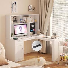 a white desk with a computer on it in a room next to a bed and window