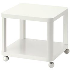 a small white table with wheels on it