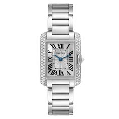 Cartier Tank Anglaise White Gold Diamond Ladies Watch WT100008. Quartz movement. 18k white gold case 30.2 x 22.7 mm. Circular grained crown set with an original Cartier factory diamond. 18k white gold original Cartier factory diamond bezel. Scratch resistant sapphire crystal. Flinque and silvered dial with black Roman numerals. Sword shaped blued steel hands. Secret Cartier signature at X. 18k white gold bracelet with hidden butterfly clasp. Fits 6" wrist. Cartier Diamond Watch With Round Dial, Cartier Diamond Watch With Diamond Accents, Cartier Diamond Watch With Palladium Hardware, Cartier Diamond Watch With Brilliant Cut, Luxury Cartier Diamond Watch For Anniversary, Luxury Cartier Diamond Watch With Diamond Accents, Cartier Diamond Watch For Wedding, Cartier Timeless Diamond Watch With Rectangular Dial, Timeless Cartier Diamond Watch With Rectangular Dial