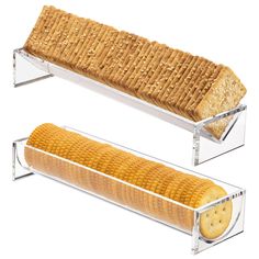 two glass shelves holding bread and crackers