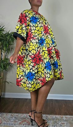 This beautifully crafted kaftan dress features a colorful colorblock pattern, with asymmetrical Ruffles sleeves and a unique button accent. The dress has a round neckline and is closed with a button, making it perfect for a variety of occasions such as travel, weddings, parties, casual or formal events, and workwear.  The dress is made from high-quality polyester material, which is machine washable for easy care. It's available in size M, and L and is handmade, perfect for women who appreciate u Bohemian Multicolor Color Block Dress, Multicolor Half Sleeve Dresses For The Beach, Multicolor Half Sleeve Dresses, Multicolor Printed Half Sleeve Dress, Multicolor Printed Dress With Asymmetrical Hem, Multicolor Beach Dress With Asymmetrical Hem, Multicolor Asymmetrical Dress With Print, Casual Multicolor Mixed Print Dress, Casual Multicolor Half Sleeve Dress