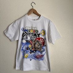 ad eBay - Vintage Super Mario Galaxy Intex White T Shirt Size Medium M - Buy Now, click the link (eBay) 90s Style White Short Sleeve T-shirt, White Short Sleeve T-shirt With 90s Style, White Short Sleeve T-shirt 90s Style, 90s Crew Neck Shirt With Sublimation Print, 90s Style Crew Neck T-shirt With Character Print, 90s Style Character Print T-shirt, 90s Character Print Short Sleeve T-shirt, 90s Short Sleeve T-shirt With Character Print, 90s Style Pre-shrunk White T-shirt