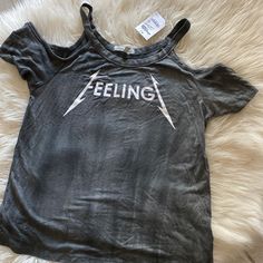 For All The Rocker Girls Out There! Grab This Cold Shoulder Tee With The Cool Feelingz Graphic Dead Center! Nwt, Never Worn Brand: Charlotte Russe Size: Xs Trendy Crew Neck Tops For Music Festival, Spring Streetwear Grunge Tops, Spring Grunge Streetwear Tops, Trendy Graphic Print Tops For Music Festival, Grunge Cotton Tops For Summer, Summer Cotton Grunge Tops, Summer Grunge Cotton Tops, Grunge Tops With Letter Print For Spring, Grunge Letter Print Tops For Spring