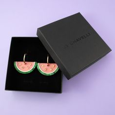 These watermelon slice earrings are so deliciously cute! Not to mention perfectly summery and beautifully polished. Designed and produced in-house, using pearly, frosted and mirrored acrylic and hand-stained wood to achieve a unique look. The watermelons hang and sway from elegant 27mm gold-filled hoops, and are removable so you can wear the hoops on their own—two earrings in one, perfect for travel! Charm measures 1. 7" w x 0. 85" h (43mm x 22mm) Wipe clean with a damp cloth. Do not submerge in water. Keep away from extreme heat. Watermelon Slice, Mirrored Acrylic, Hoop Charms, Watermelon Slices, Gold Filled Hoops, Pearl Collection, Stained Wood, Extreme Heat, Gold Filled Jewelry