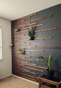 a living room with some plants on the wall