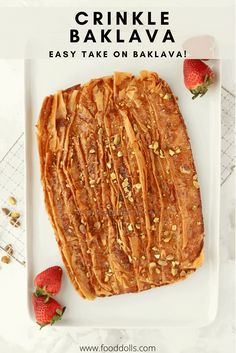 crinkle bakalava on a white plate with strawberries and almonds