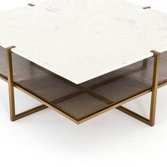 a white marble top coffee table with two metal legs on each side and a brown mesh shelf underneath it