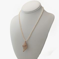 Elevate your outfit with this exquisite Chinese Freshwater seed pearl necklace. Crafted with stunning attention to detail, its timeless design is finished with a 14K yellow gold pearl clasp that beautifully complements the necklace's white color and neutral overtones. Measuring 18" (46cm) in length and weighing 14.6g, this necklace offers both elegance and comfort for all-day wear. The pearls in the necklace are oval shape and exhibit a radiant luster, adding a touch of sophistication to any ens Shell-shaped Pearl Pendant Necklace, Elegant Shell-shaped Shell Necklace With Pearl Drop, Elegant Shell-shaped Pearl Chain Necklace, Elegant Pearl White Shell-shaped Necklace, Elegant Gold Shell-shaped Pearl Necklace, Pearl Clasp, Seed Pearl, Freshwater Pearl Necklaces, Shell Pendant