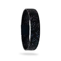 a black bracelet with blue and pink dots on it