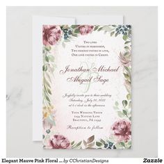 an elegant floral wedding card with watercolor flowers and greenery on the front, in pink