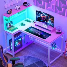 a desk with a computer and gaming accessories on it