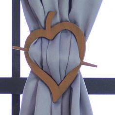 a curtain with a heart cut out of it