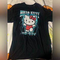 Black And Blue Hello Kitty Lightning T-Shirt In A Men’s Size Large And Medium!New And With Tag! Thank You For Looking At My Shop I Have More Sanrio And Hello Kitty As Well As Other Items Listed Trendy Black Shirt For Fan Merchandise, Cute Black Crew Neck Shirt, Black Y2k T-shirt With Cartoon Print, Y2k Black T-shirt With Cartoon Print, Black Y2k Style T-shirt With Cartoon Print, Trendy Black Shirt With Character Print, Cute Black T-shirt With Screen Print, Cute Black Crew Neck T-shirt, Black Y2k Shirt With Crew Neck