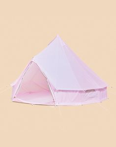 a pink tent sitting on top of a white floor next to a brown and tan wall