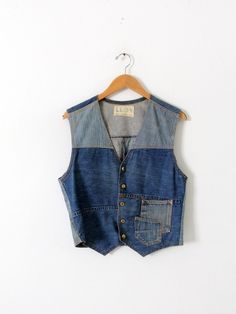 "This is a vintage custom denim vest.  The hand-crafted vest features a patchwork of denim tones with two overlapping pockets on the front.  It buttons closed with a v-neckline.  CONDITION In good condition with wear consistent with age and use.  APPROXIMATE FIT :  Men's M or Women's L MEASUREMENTS Bust:  38\"  ..  96.5 cm Length:  20.25\"  .. 51.4 cm Shoulders:  15.5\"  .. 39.4 cm Waist:  34\"  .. 86.4 cm 52143" Vintage Denim Vest, Jeans West, Long Sleeve Outfits, Custom Denim, Outfit Formulas, Denim Patchwork, Vest Outfits, Denim Vest, Vintage Jeans