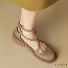 Summer Brown Closed Toe Mary Janes, Summer Mary Jane Flats With Round Toe, Adjustable Beige T-strap Sandals With Round Toe, Beige Adjustable T-strap Sandals With Round Toe, Casual T-strap Sandals With Rubber Sole And Round Toe, Casual T-strap Sandals With Round Toe And Rubber Sole, Casual Low Heel T-strap Sandals For Spring, Summer Flat Heel Mary Janes With Heel Strap, Mary Jane T-strap Sandals With Heel Strap