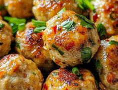 meatballs covered in sauce and garnished with herbs