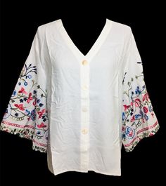 Beautiful cotton embroidered bell sleeve tunic top. Very light and breathable fabric.  An ideal tunic/top for Spring and Summer. Sleeves embellished with multi- color floral embroidery. Looks very elegant and perfect for evening wear, office wear, beach wear, resort wear. Size chart is posted with pics. Spring Floral Embroidered V-neck Top, Embroidered V-neck Top For Day Out, Fall Vacation Tops With Bell Sleeves, Bell Sleeve Tops For Fall Vacation, Fall Vacation Bell Sleeve Tops, Spring Vacation Cotton Tunic, Spring V-neck Blouse With Chikankari Embroidery, Cotton Tops With Kimono Sleeves For Fall, Bohemian Spring Tops With 3/4 Sleeves