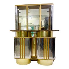 three tiered brass and glass display case