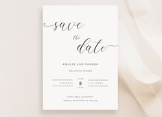 the save the date card is on top of a white ribbon