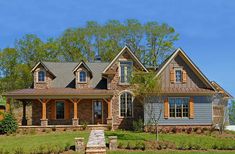 a large house with lots of windows in the front yard