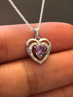 "Sterling Silver Amethyst CZ Heart Necklace Metal: All components are made from solid .925 Sterling Silver Stone: Cubic Zirconia Measurement: pendant is 17mm (0.67\")long including bail and 12mm (0.47\") wide Choose Chain Length Please feel free to Convo me with any questions before purchasing. Please view policy before purchasing You can find other CZ and Birthstone Jewelry in my shop here https://www.etsy.com/shop/LinksAndStones?ref=seller-platform-mcnav&section_id=24399452 Thank You For V Sterling Silver Heart Birthstone Necklace, Amethyst Gemstone Necklace For Valentine's Day, Purple Double Heart Jewelry For Valentine's Day, Valentine's Day Amethyst Heart Necklace, Sterling Silver Heart Pendant Birthstone Necklace, Sterling Silver Birthstone Necklace With Heart Pendant, Heart-shaped Sterling Silver Birthstone Necklace As Gift For Her, Sterling Silver Open Heart Birthstone Necklace, Purple Heart Necklace For Valentine's Day Anniversary