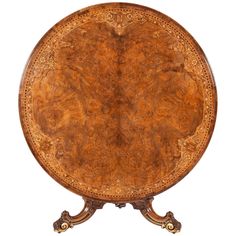 an antique wooden table with ornate carvings on it