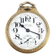 This antique pocket watch was made by the well known Hamilton watch company of the United States in approximately 1920. The watch is in good working order with a white porcelain face and large Arabic numerals. The case is gold filled and contains the 16S Railroad Special movement. The watch is in very good period condtion showing minor wear to the crown and exterior of the case as presented. The watch comes with its original felt box. Antique Pocket Watch, Hamilton Watch, Pocket Watch Antique, Watch Companies, Luxury Watch, White Porcelain, Vintage Watches, Pocket Watch, The Well