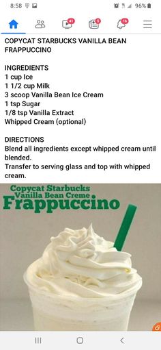 a cup filled with whipped cream next to a green straw