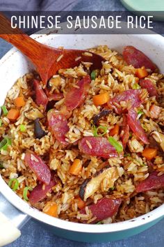 chinese sausage rice in a white bowl with a wooden spoon