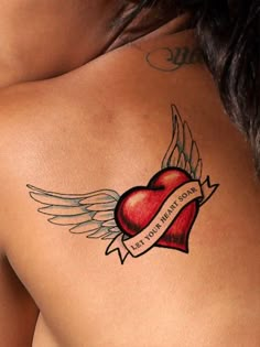 a woman with a heart and wings tattoo on her back