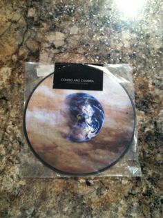 the cd is in its package on top of the marble countertop, and it's ready to be used