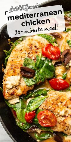 chicken with tomatoes, spinach and mushrooms in a skillet on a marble surface