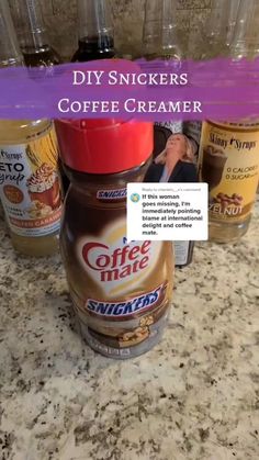 coffee creamer is sitting on the counter next to other cups and containers with text that reads diy snickkers coffee creamer