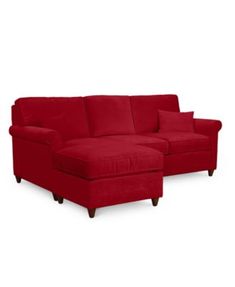 a red sectional couch with pillows on the back and footrests, in front of a white background