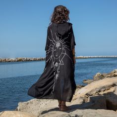 Black Wearable Art Hooded Kimono designed by 3 Soul Sisters... We are so happy to introduce the new kimonos design we have co-created with our soul sisters Svetlana of FLO Art and Violetta of The Next Level People. Connecting the magic of Bali and the beauty of California we have designed these beautiful hooded kimonos, transforming the gorgeous art sketch The Wandering Monk into a print and giving Him a new dharma and a new path to walk the Earth, staying true to our mission of making this worl Mens Kimono Shirt, Hooded Kimono, Summer Goddess, Male Kimono, Festival Jacket, Kimono Design, Black Kimono, Beautiful Goddess, Hat Ideas